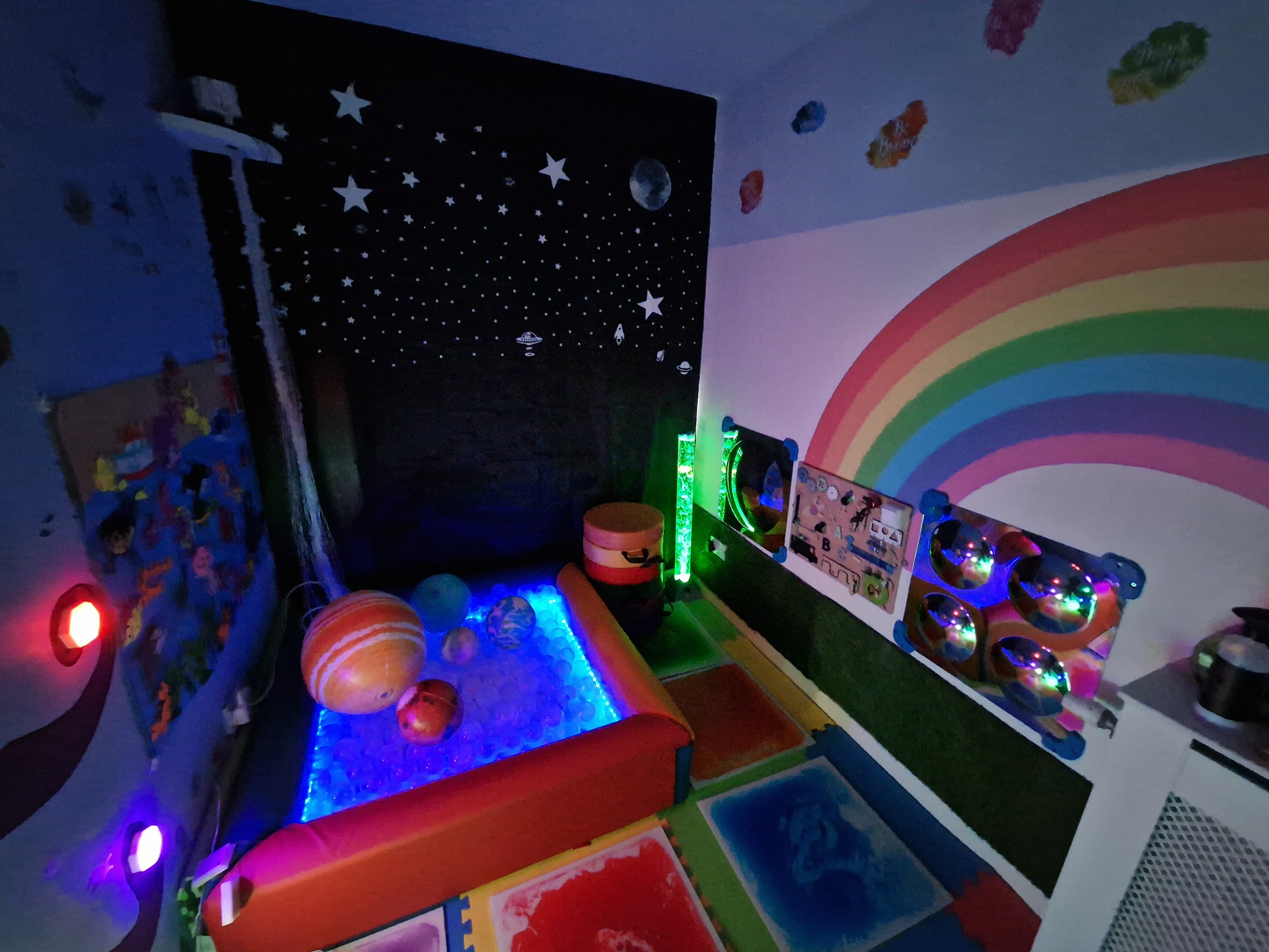 Comfortable seating and tactile toys in the sensory room